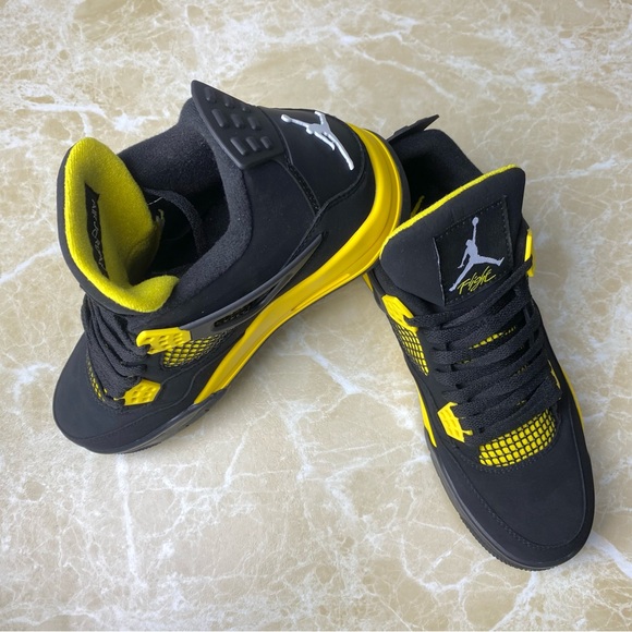 black and yellow flight jordans